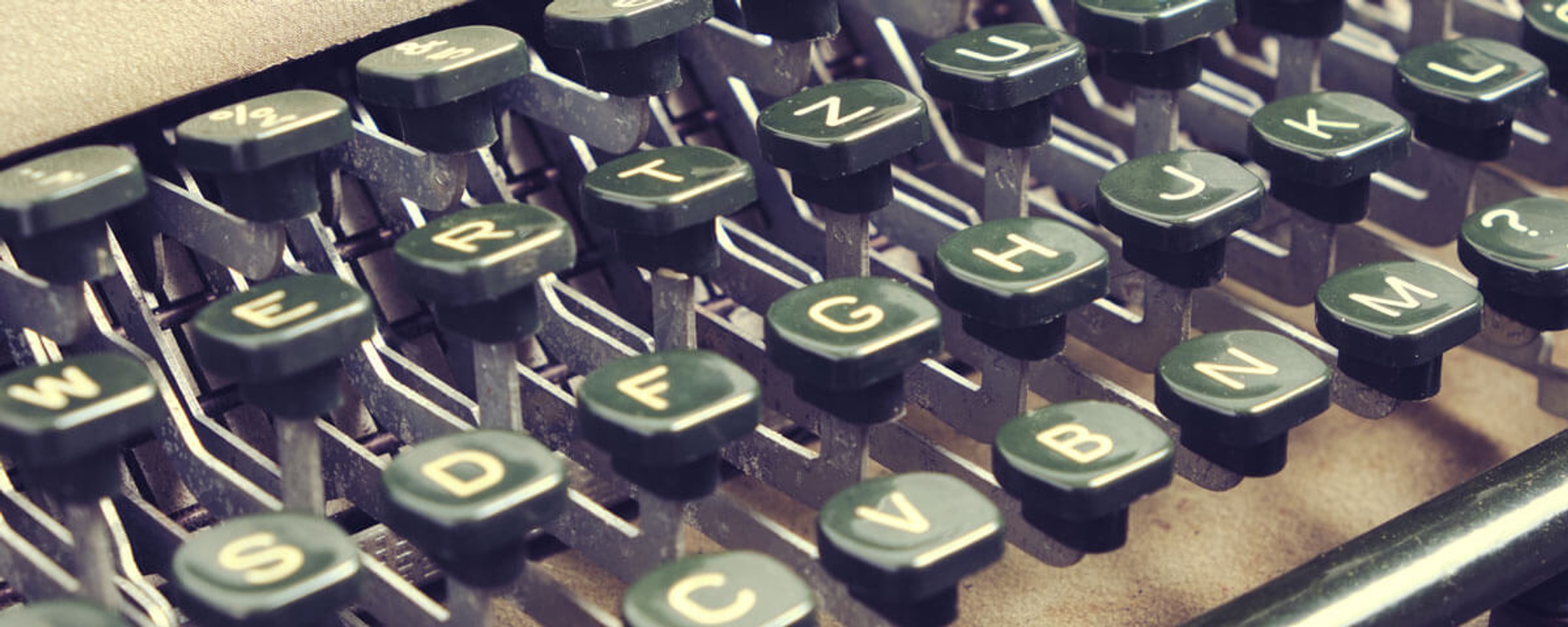A close-up of keys on a vintage typewriter.